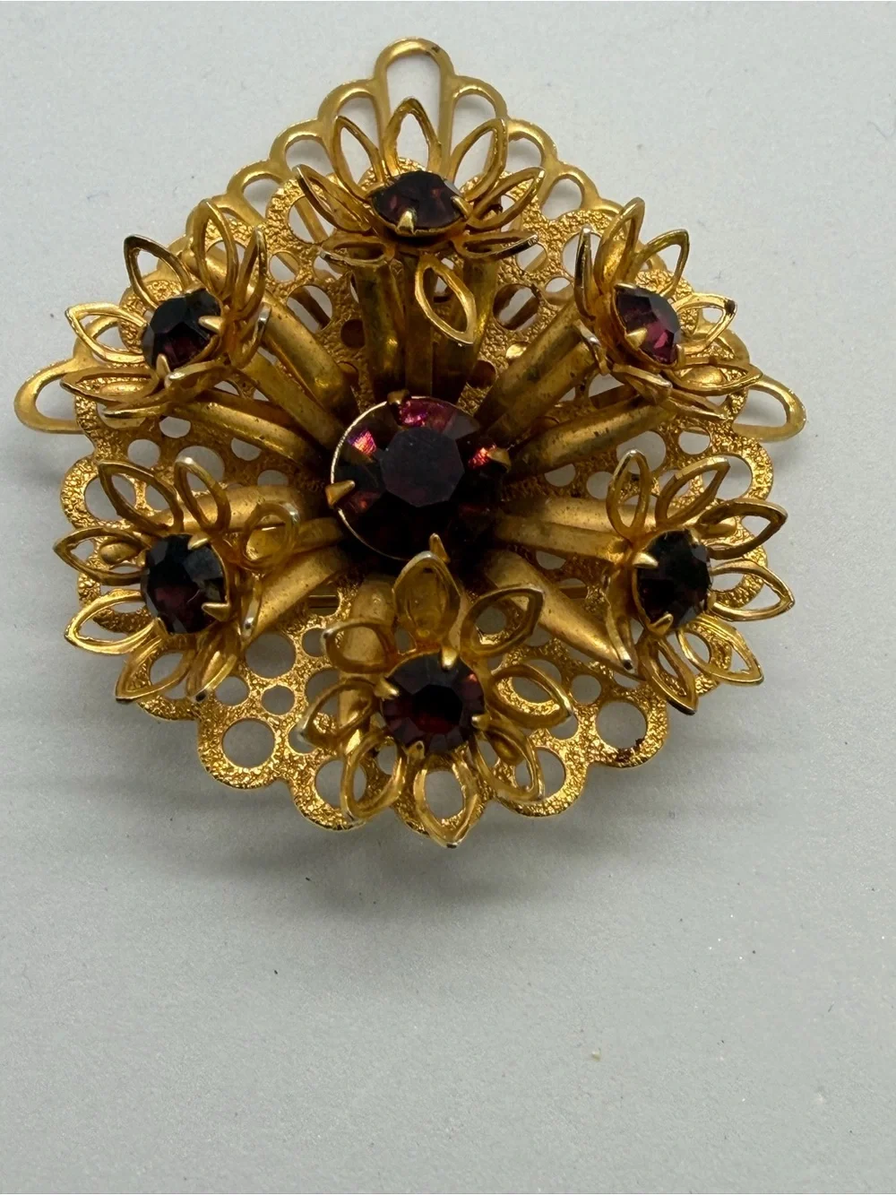 Vintage Gold-Tone Floral Brooch with Deep Red Stones